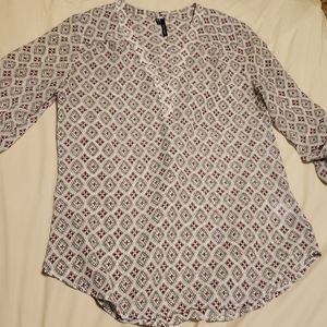 Maurice's patterned maroon blouse